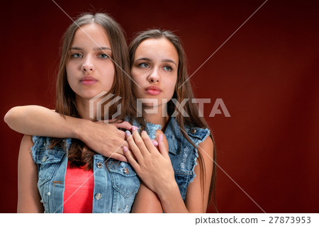 Portrait of two beautiful twin young women Portrait of two beautiful twin young women 27873953