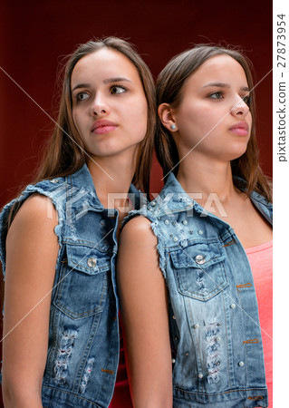 Portrait of two beautiful twin young women Portrait of two beautiful twin young women 27873954