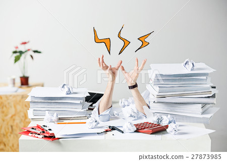 The many crumpled papers on desk of stressed male The many crumpled papers on desk of stressed male 27873985
