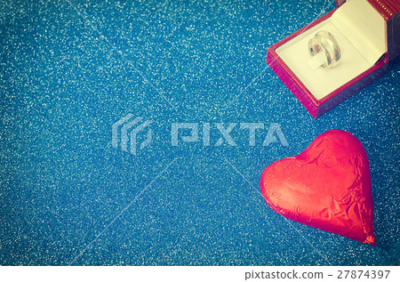 chocolate heart and ringon blue background texture chocolate heart and ringon blue background texture 27874397