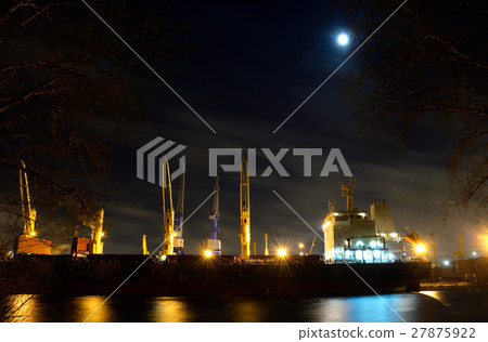 loading cargo ship with cranes is moored in port loading cargo ship with cranes is moored in port 27875922