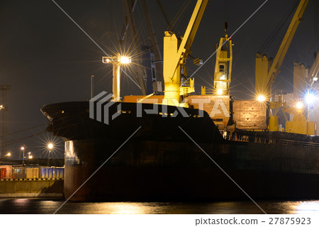 loading cargo ship with cranes is moored in port loading cargo ship with cranes is moored in port 27875923
