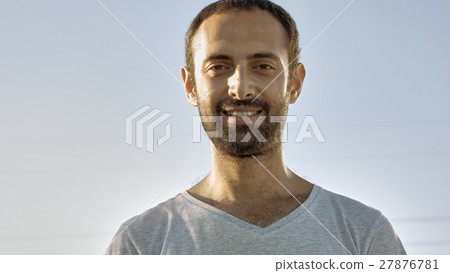 Cheerful man smiles with teeth and nods head 27876781