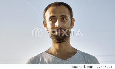 Cheerful man smiles with teeth and nods head Cheerful man smiles with teeth and nods head 27876793