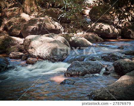 Creek Falls and over rock in forest 27876979