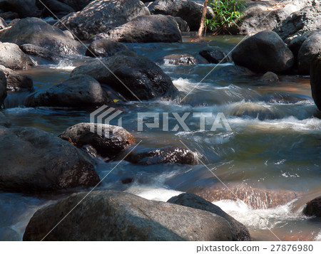 Creek Falls and over rock in forest 27876980
