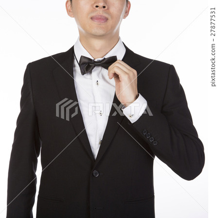 businessman adjusting white bow tie businessman adjusting white bow tie 27877531