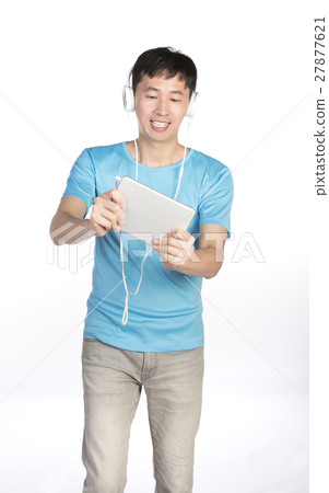 man playing with tablet man playing with tablet 27877621