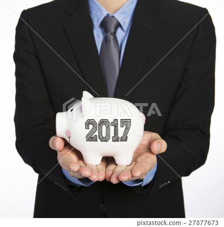 Man holding a piggy bank Man holding a piggy bank 27877673