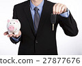 Man with a piggy bank and key 27877676