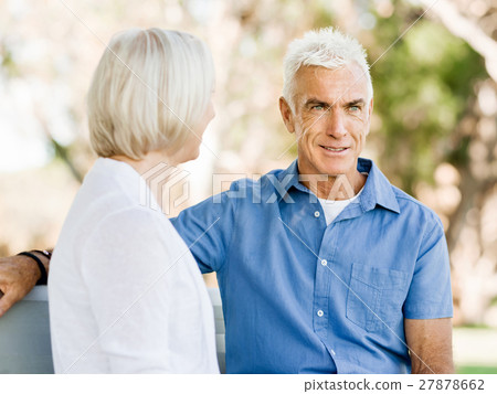 Senior couple relaxing in park Senior couple relaxing in park 27878662