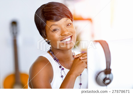 Portrait of businesswoman working at her desk in office 27878671