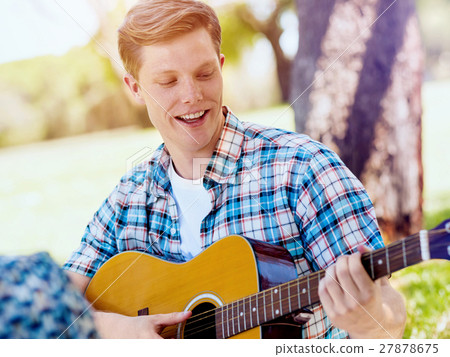 Group of happy friends with guitar having fun outdoor Group of happy friends with guitar having fun outdoor 27878675