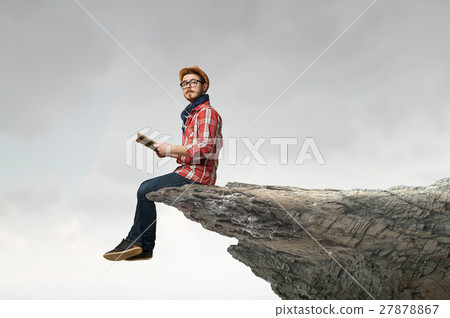 Hipster guy with book 27878867