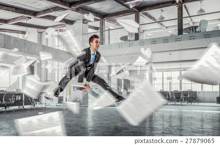Jumping businessman in office Jumping businessman in office 27879065