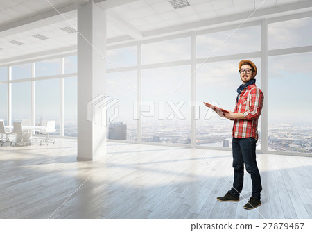 Hipster guy with book 27879467