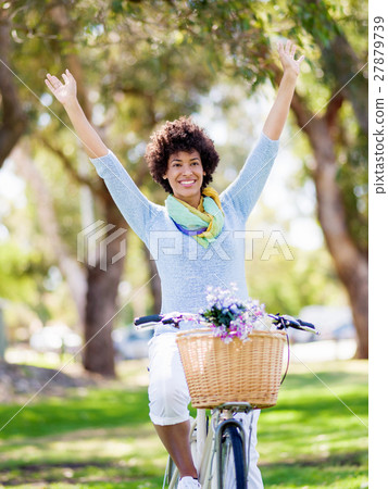Happy young woman with bicycle 27879739