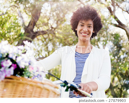 Happy young woman with bicycle Happy young woman with bicycle 27879903