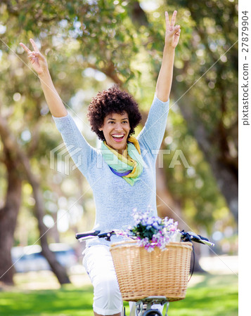 Happy young woman with bicycle Happy young woman with bicycle 27879904