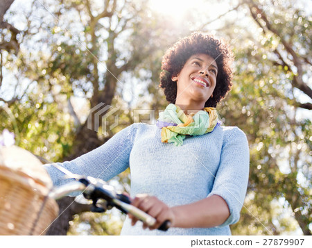 Happy young woman with bicycle Happy young woman with bicycle 27879907