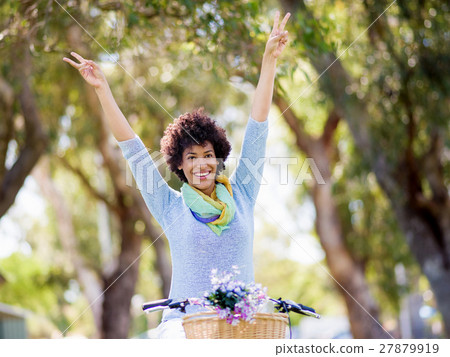 Happy young woman with bicycle Happy young woman with bicycle 27879919