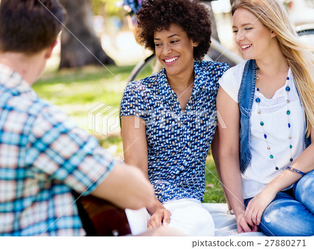 Group of happy friends with guitar having fun outdoor Group of happy friends with guitar having fun outdoor 27880271