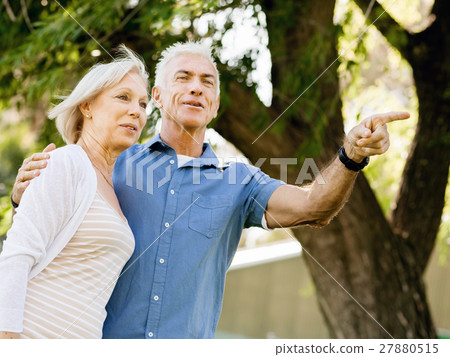 Senior couple relaxing in park Senior couple relaxing in park 27880515