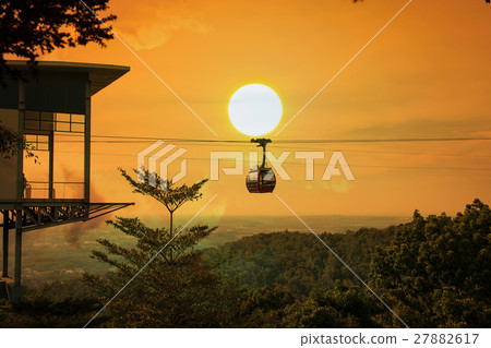 Cable car on the  mountain sunset background 27882617