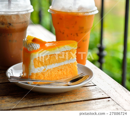 Orange cake and cold drink 27886724