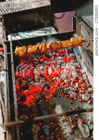 A barbecue skewer spinning on the grill. A barbecue skewer spinning on the grill. 27886801