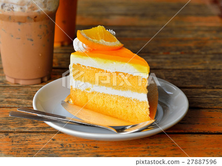 Orange cake and cold coco on wooden background 27887596
