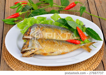Fried Mackerel on wooden background 27887737