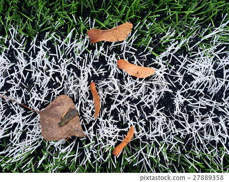 End of football season.Plastic green football turf End of football season.Plastic green football turf 27889358