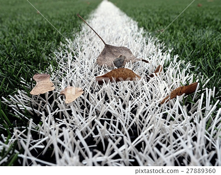 End of football season.Plastic green football turf End of football season.Plastic green football turf 27889360