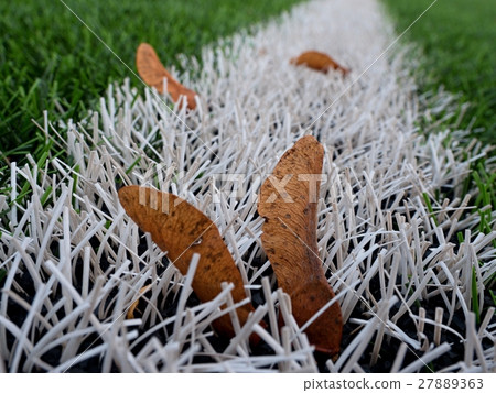 End of football season.Plastic green football turf End of football season.Plastic green football turf 27889363