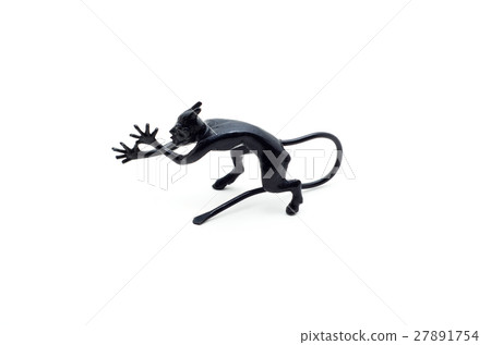 Metal devil figurine in a sneering posture. 27891754