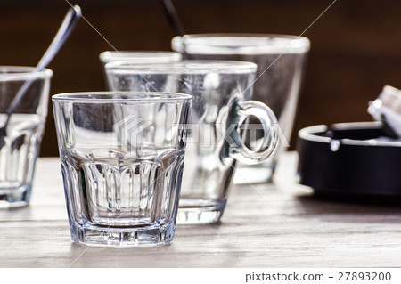 Close-up picture of a glass water which is hal Close-up picture of a glass water which is hal 27893200
