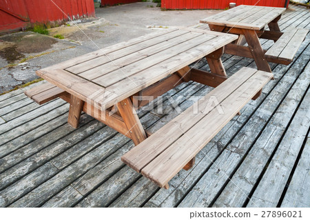 Empty wooden tables with benches 27896021