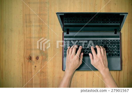 man using laptop on desk man using laptop on desk 27901567