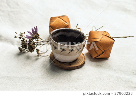 Clay pot and small wooden boxes placed on linen Clay pot and small wooden boxes placed on linen 27903223