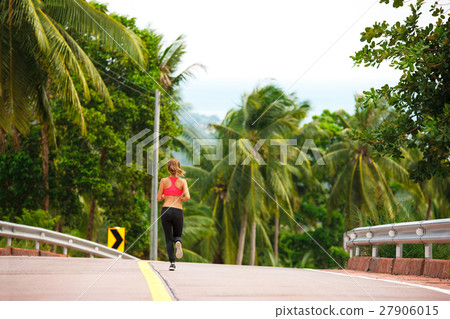 fitness woman running at tropical forest trail fitness woman running at tropical forest trail 27906015