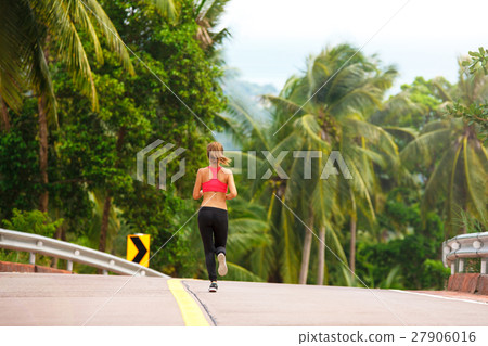 fitness woman running at tropical forest trail fitness woman running at tropical forest trail 27906016