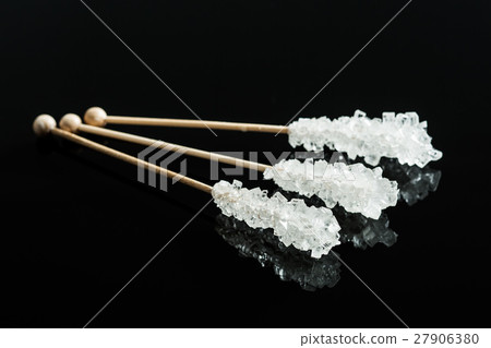 Crystallized sugar on wooden stick. 27906380