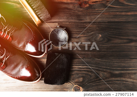 leather shoes on table with polishing equipment 27907114