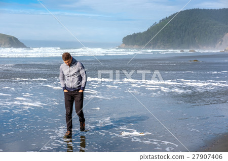 Lone man at USA Pacific coast beach Lone man at USA Pacific coast beach 27907406