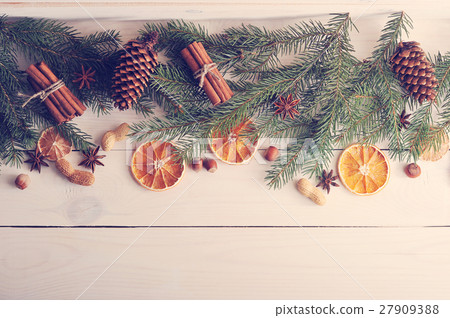 Christmas background with Christmas tree branches, pine cones, d 27909388