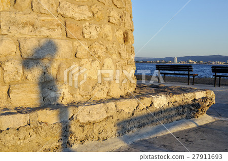 Shadow of street telescope on embankment of the sea Shadow of street telescope on embankment of the sea 27911693