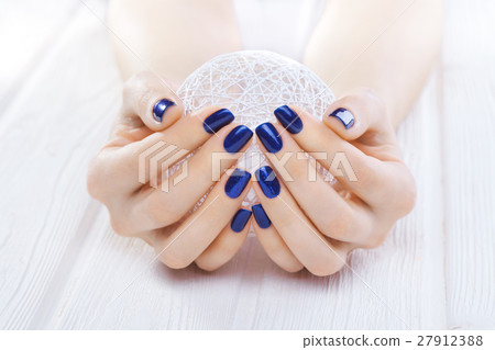 blue manicure with a white ball of yarn blue manicure with a white ball of yarn 27912388