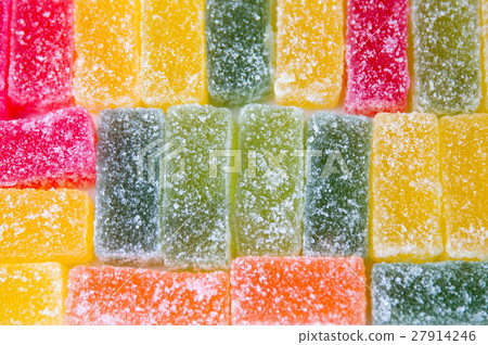Jelly sweets in a row background 27914246
