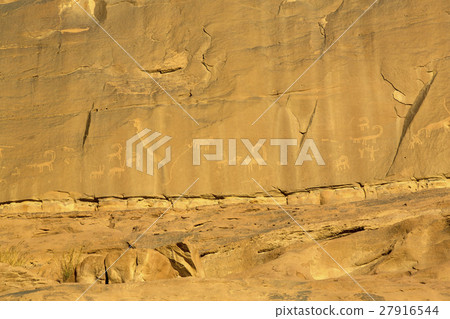 Rock carvings on rocks in the desert of Wadi Rum Rock carvings on rocks in the desert of Wadi Rum 27916544